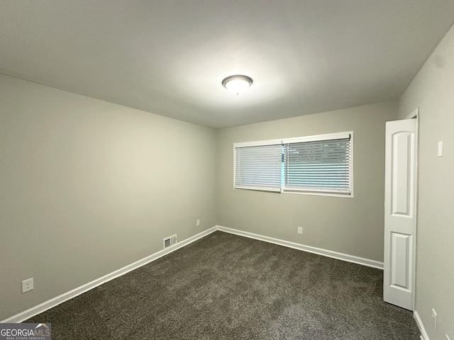 2644 Connally Dr, East Point, GA 30344 - unfurnished room with dark colored carpet and baseboards