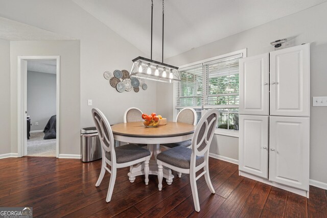 1535 Smoke Hill Dr, Hoschton, GA 30548 - dining area featuring dark wood-style flooring and vaulted ceiling