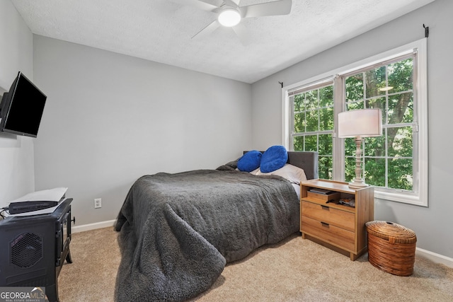 1535 Smoke Hill Dr, Hoschton, GA 30548 - bedroom featuring light colored carpet, a ceiling fan, and a textured ceiling