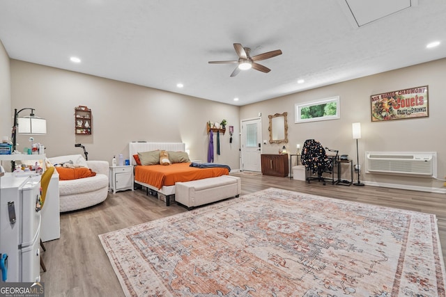 1535 Smoke Hill Dr, Hoschton, GA 30548 - bedroom with wood finished floors, a wall unit AC, recessed lighting, attic access, and a ceiling fan