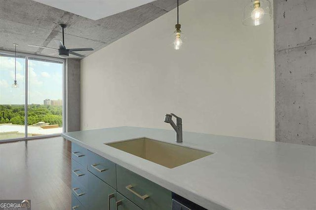 361 17th St Unit 910, Atlanta, GA 30363 - kitchen featuring a wall of windows, light countertops, ceiling fan, wood finished floors, and pendant lighting