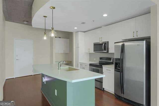 361 17th St Unit 910, Atlanta, GA 30363 - kitchen featuring stainless steel appliances, white cabinetry, light countertops, and recessed lighting