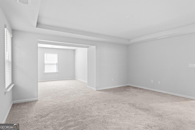 400 Paulownia Cir, Mcdonough, GA 30253 - carpeted empty room with a tray ceiling