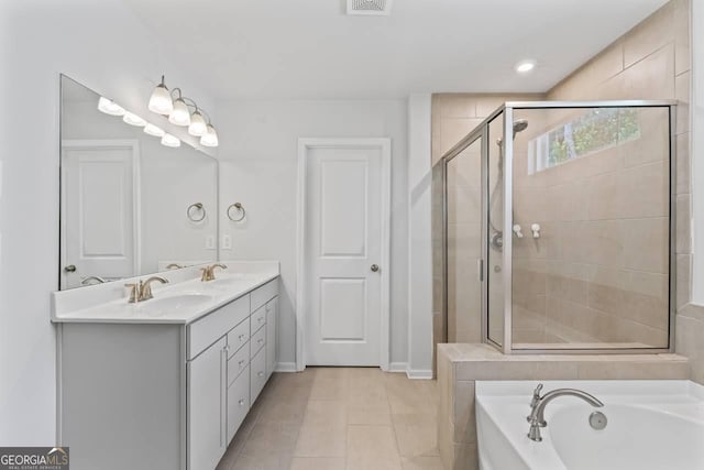 400 Paulownia Cir, Mcdonough, GA 30253 - bathroom with a bath, double vanity, a stall shower, and tile patterned flooring