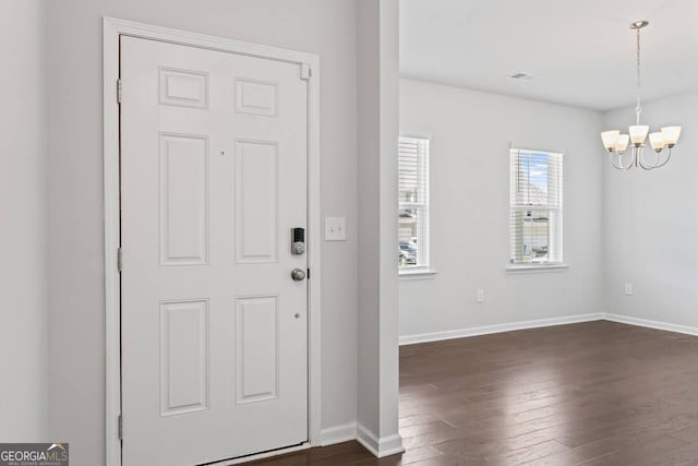 400 Paulownia Cir, Mcdonough, GA 30253 - entryway featuring a chandelier and dark wood-type flooring