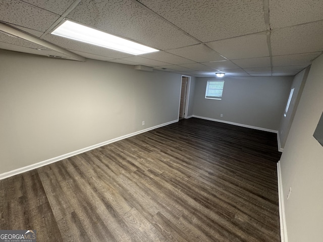 4329 Parkview Dr, Lithia Springs, GA 30122 - below grade area with a drop ceiling and dark wood-style flooring