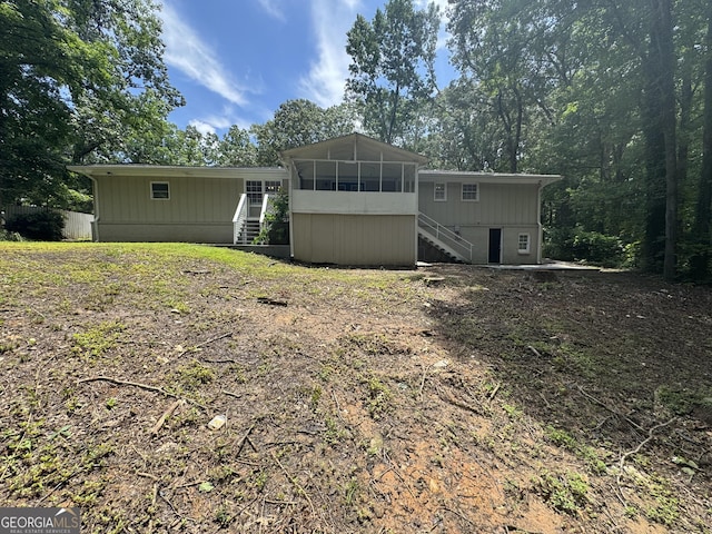 4329 Parkview Dr, Lithia Springs, GA 30122 - rear view of property with stairway and a sunroom