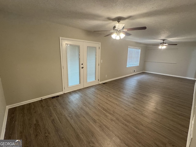 4329 Parkview Dr, Lithia Springs, GA 30122 - spare room featuring a textured ceiling, french doors, dark wood-style floors, and a ceiling fan