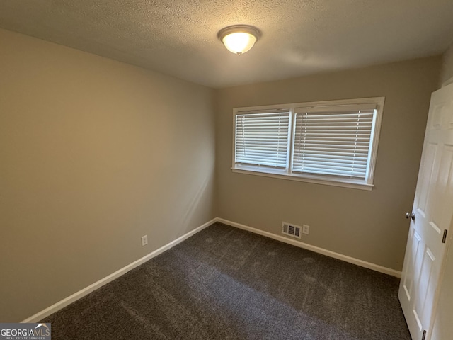 4329 Parkview Dr, Lithia Springs, GA 30122 - unfurnished room with dark carpet and a textured ceiling