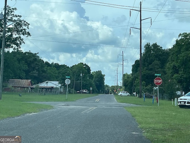 127 S 22nd St, Defuniak Springs, FL 32435 - view of asphalt road featuring traffic signs