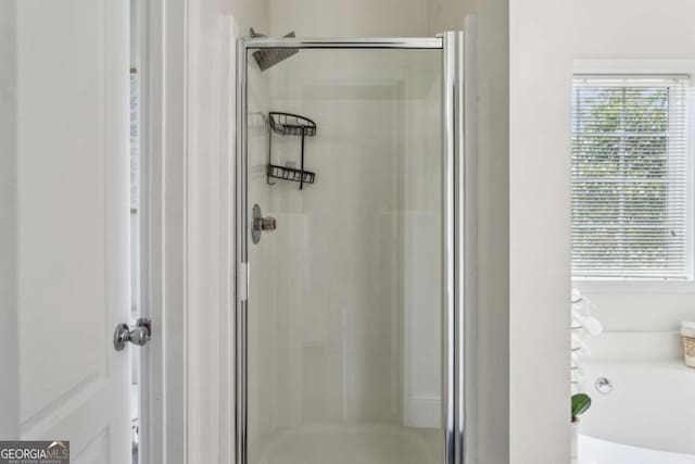 2140 Hurt Rd SW, Marietta, GA 30008 - bathroom with a stall shower and a garden tub