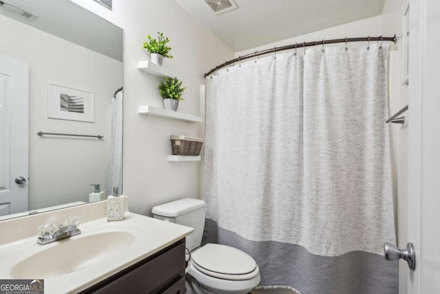2140 Hurt Rd SW, Marietta, GA 30008 - full bathroom featuring toilet and vanity