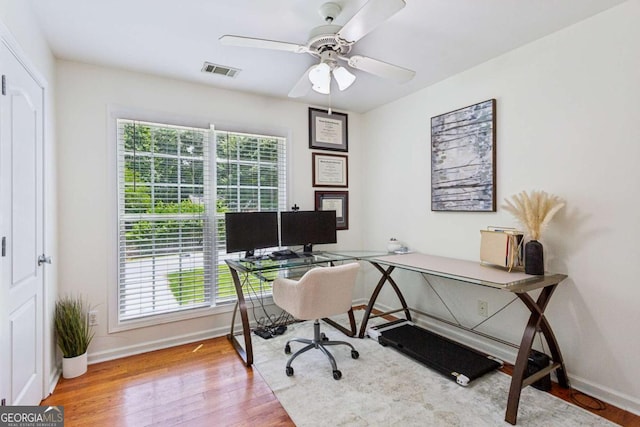 2140 Hurt Rd SW, Marietta, GA 30008 - home office with wood finished floors and ceiling fan