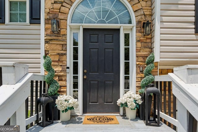 2140 Hurt Rd SW, Marietta, GA 30008 - property entrance featuring stone siding and a porch