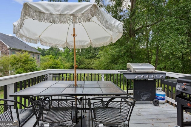 2140 Hurt Rd SW, Marietta, GA 30008 - wooden terrace featuring outdoor dining space and area for grilling