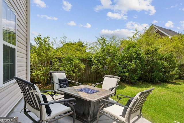 2140 Hurt Rd SW, Marietta, GA 30008 - view of patio / terrace featuring an outdoor fire pit