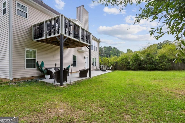 2140 Hurt Rd SW, Marietta, GA 30008 - rear view of property with a chimney, a yard, a patio, and a deck