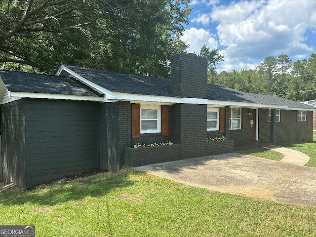 6914 N Baggett Rd, Douglasville, GA 30134 - view of front facade featuring a chimney, brick siding, and a front yard