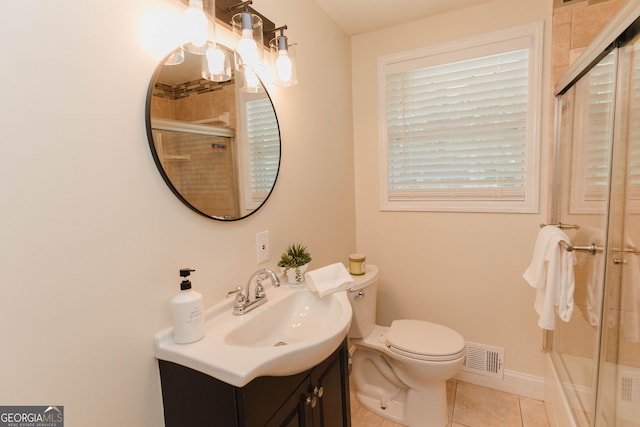 6914 N Baggett Rd, Douglasville, GA 30134 - bathroom with tile patterned floors, vanity, and an enclosed shower