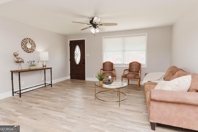 6914 N Baggett Rd, Douglasville, GA 30134 - living area with a baseboard heating unit, ceiling fan, and wood finished floors