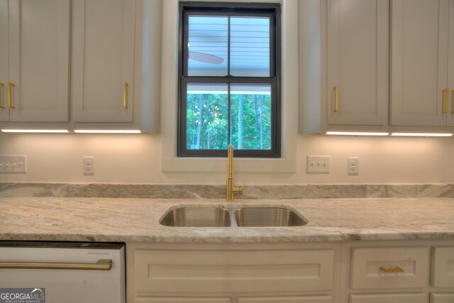 24 Fieldstone Dr NE, Rome, GA 30161 - kitchen with white dishwasher, white cabinetry, and light stone countertops