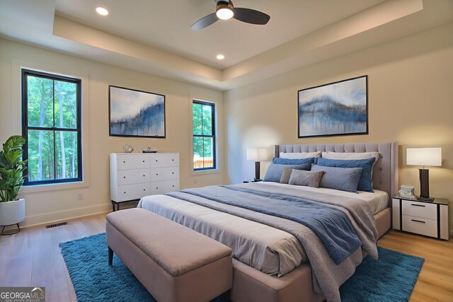 24 Fieldstone Dr NE, Rome, GA 30161 - bedroom with a tray ceiling, light wood-type flooring, and recessed lighting