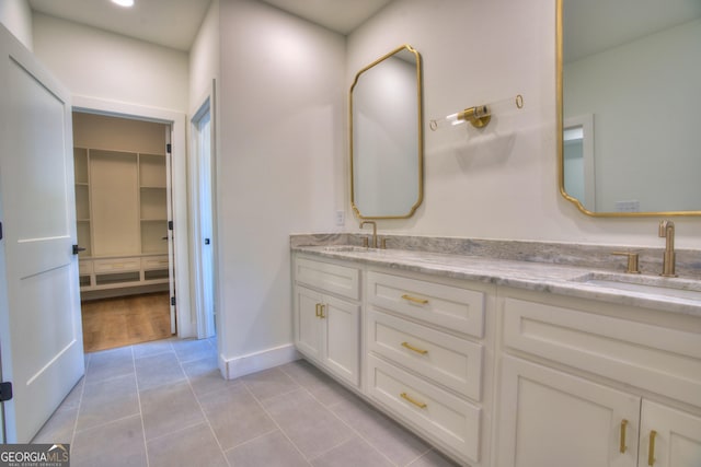 24 Fieldstone Dr NE, Rome, GA 30161 - bathroom with double vanity, tile patterned flooring, and a walk in closet