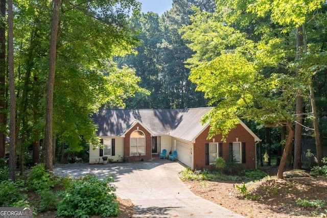 2030 Buford Dam Rd, Buford, GA 30518 - single story home featuring driveway, an attached garage, and brick siding
