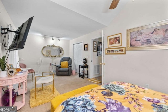 2030 Buford Dam Rd, Buford, GA 30518 - carpeted bedroom featuring track lighting, a closet, ceiling fan, and vaulted ceiling