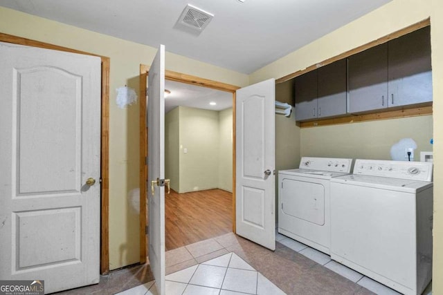 2030 Buford Dam Rd, Buford, GA 30518 - laundry room featuring cabinet space, independent washer and dryer, light tile patterned flooring, and recessed lighting