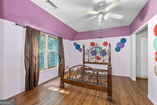 2030 Buford Dam Rd, Buford, GA 30518 - bedroom with wood finished floors, vaulted ceiling, and a ceiling fan