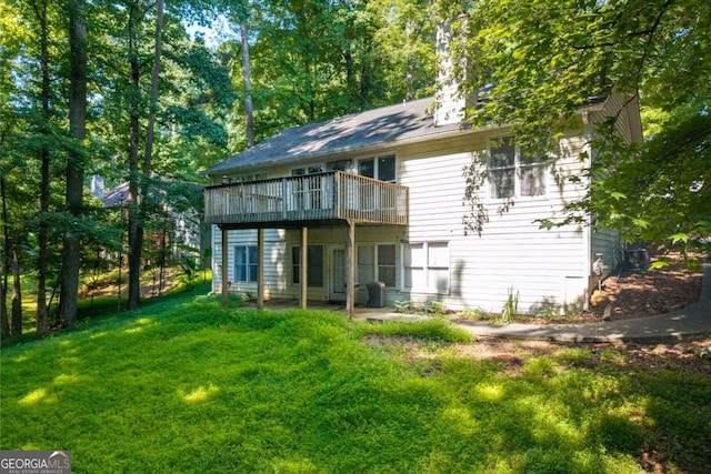 2030 Buford Dam Rd, Buford, GA 30518 - back of house featuring a yard, a wooden deck, and a chimney
