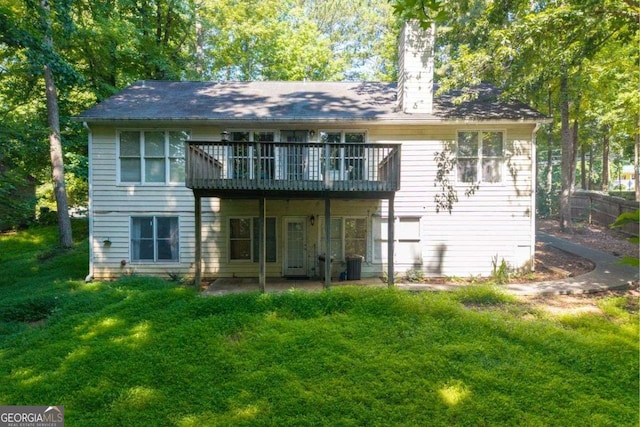 2030 Buford Dam Rd, Buford, GA 30518 - rear view of house with a chimney, a yard, and a wooden deck