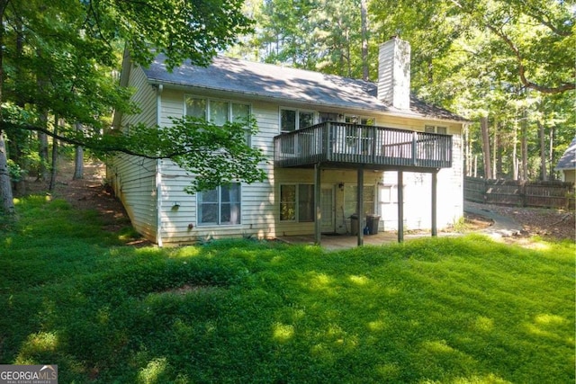 2030 Buford Dam Rd, Buford, GA 30518 - back of property with a chimney, a deck, and a patio area