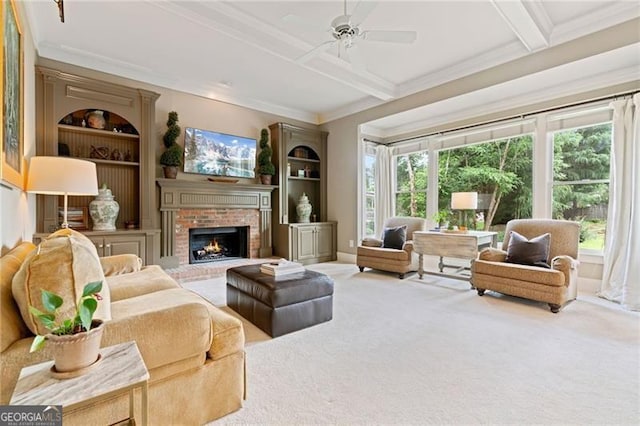 295 Sagamore Cv NW, Sugar Hill, GA 30518 - living area featuring crown molding, carpet floors, a ceiling fan, a fireplace, and beamed ceiling