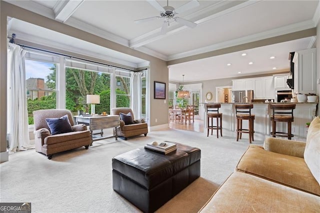 295 Sagamore Cv NW, Sugar Hill, GA 30518 - living area featuring light colored carpet, beamed ceiling, plenty of natural light, crown molding, and ceiling fan