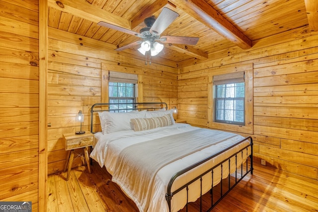 371 Abbott Top Rd, Ellijay, GA 30540 - bedroom featuring a wooden ceiling with exposed beams, wood walls, wood-type flooring, and ceiling fan