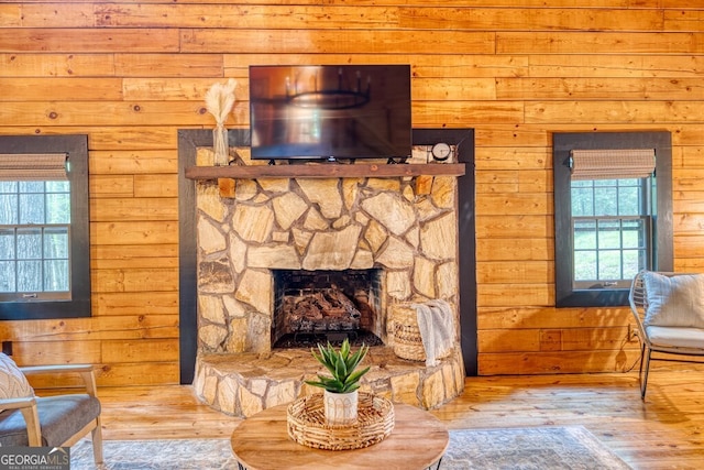 371 Abbott Top Rd, Ellijay, GA 30540 - living room with hardwood / wood-style floors, wooden walls, and a fireplace