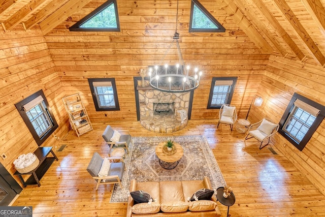 371 Abbott Top Rd, Ellijay, GA 30540 - living area with high vaulted ceiling, wood walls, wood-type flooring, a wood ceiling with exposed beams, and plenty of natural light
