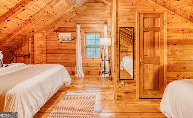 371 Abbott Top Rd, Ellijay, GA 30540 - bedroom with wood walls, light wood-style floors, and wooden ceiling
