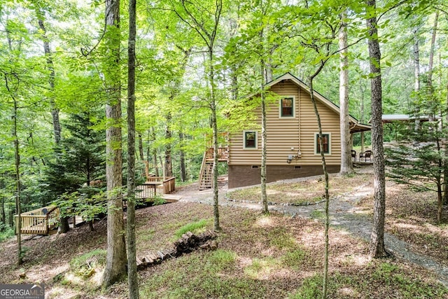 371 Abbott Top Rd, Ellijay, GA 30540 - view of side of home featuring crawl space, stairway, a view of trees, and a wooden deck