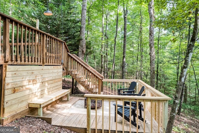 371 Abbott Top Rd, Ellijay, GA 30540 - wooden deck with stairway, a fire pit, and a view of trees