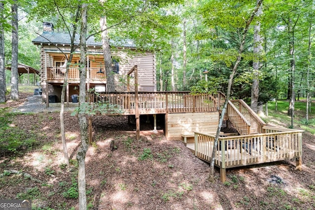 371 Abbott Top Rd, Ellijay, GA 30540 - rear view of house featuring a deck, log siding, stairway, and a chimney
