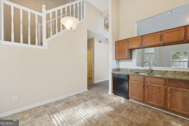 686 Shore Ln, Lithonia, GA 30058 - kitchen with dishwasher, brown cabinetry, stone countertops, and a high ceiling