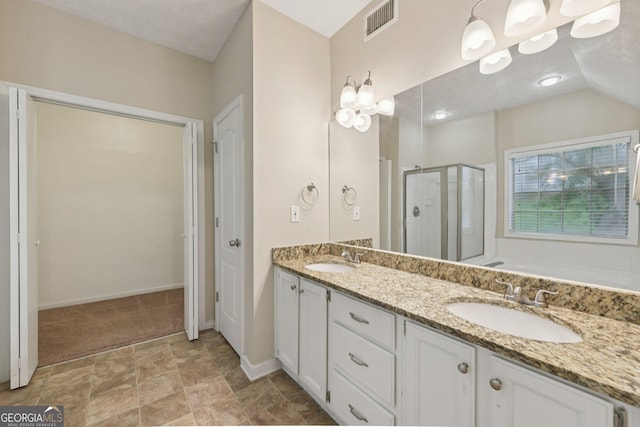 686 Shore Ln, Lithonia, GA 30058 - bathroom featuring a shower stall, double vanity, a bath, and stone finish flooring