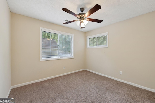 686 Shore Ln, Lithonia, GA 30058 - carpeted empty room with baseboards and a ceiling fan