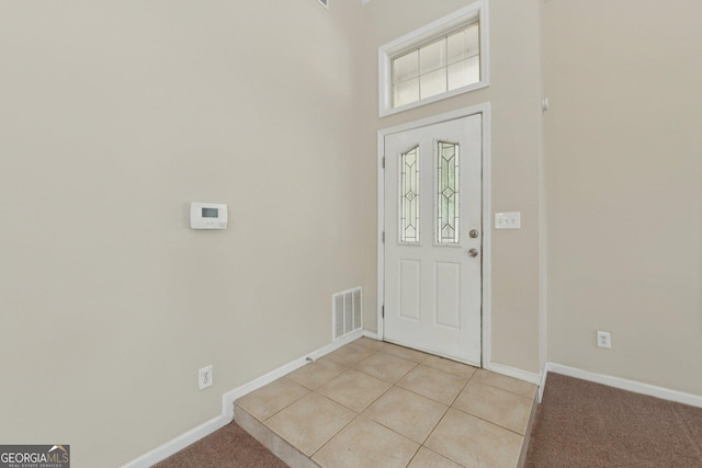 686 Shore Ln, Lithonia, GA 30058 - foyer entrance featuring baseboards and light colored carpet