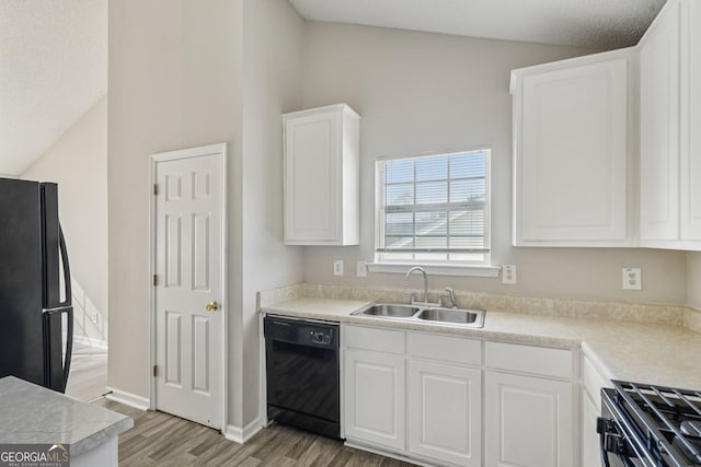 4738 Golod Way, Lithonia, GA 30038 - kitchen featuring black appliances, light wood-style flooring, white cabinetry, and light countertops