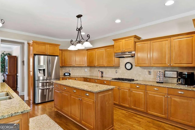7198 Golfside Dr SE, Covington, GA 30014 - kitchen featuring stainless steel fridge with ice dispenser, under cabinet range hood, a kitchen island, dark wood-type flooring, and decorative backsplash