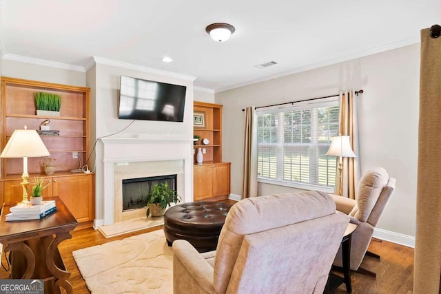 7198 Golfside Dr SE, Covington, GA 30014 - living area featuring crown molding, wood finished floors, and a premium fireplace